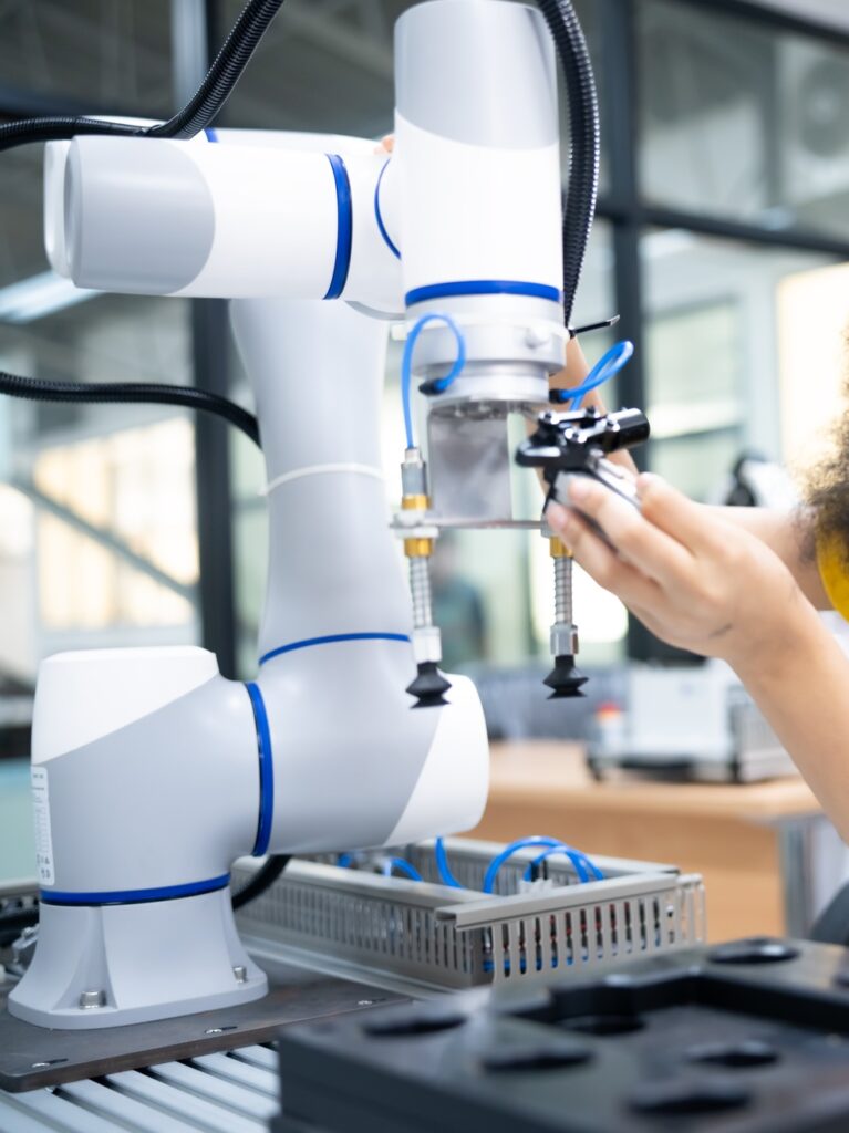 Student working with robot for science project. Students studying robotic at an university institute